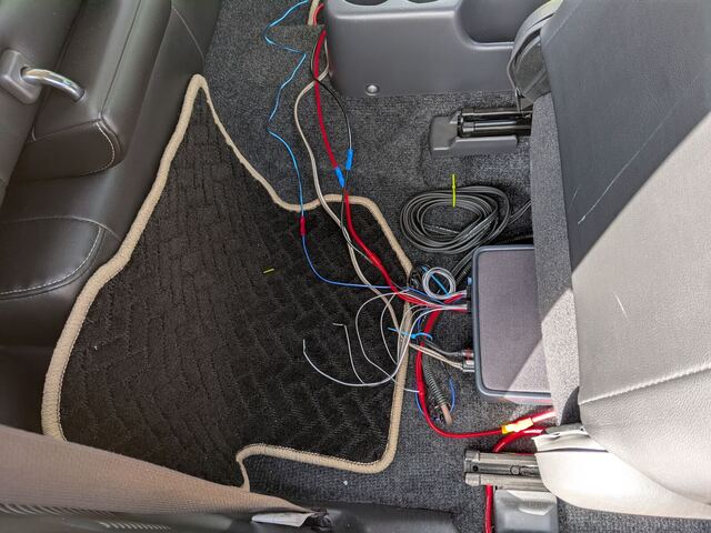 Wiring in progress between the seats