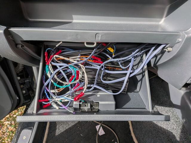 The glovebox packed with wiring