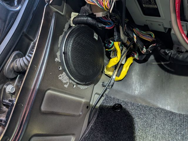MW4 fitted in the passenger-side kick panel